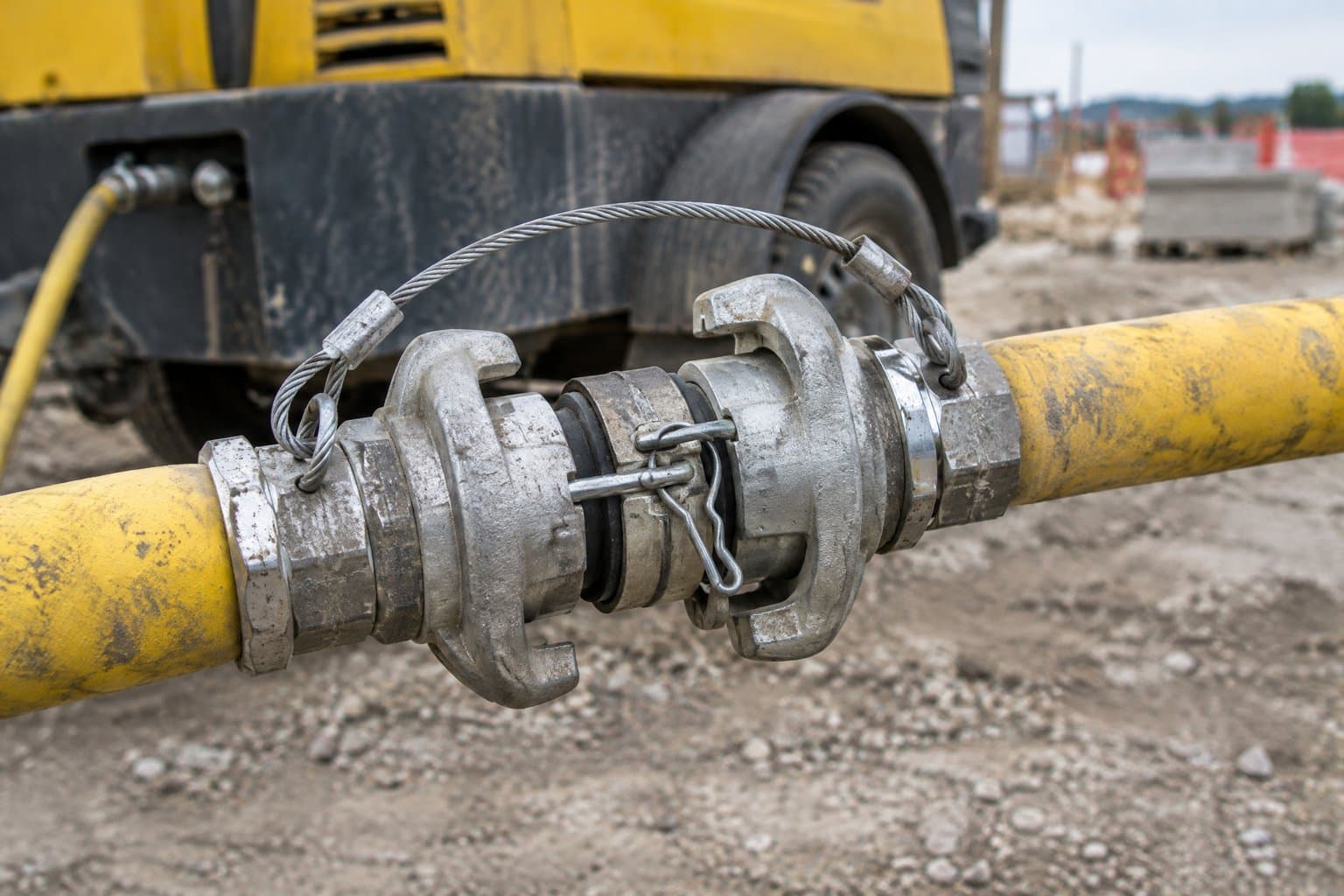 Two universal claw air couplings locked together with a safety whip check on a compressor hose