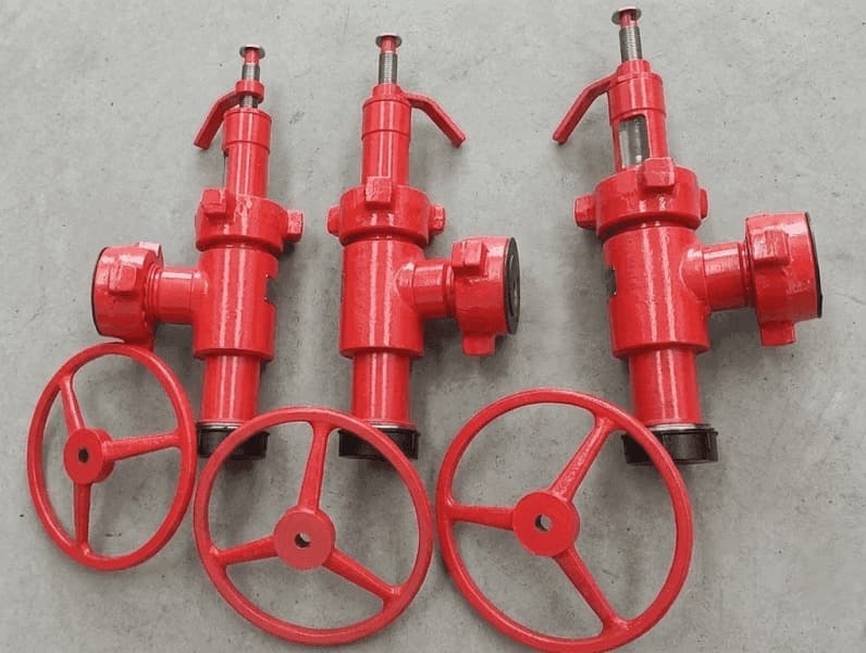 Three red adjustable manual chokes with handwheels, 602 F×M, 6,000 psi