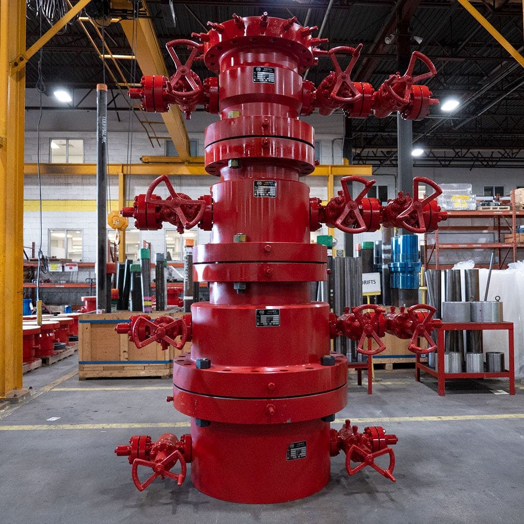 Red multi-bowl wellhead stack with valves in a workshop, API 6B 3K casing head