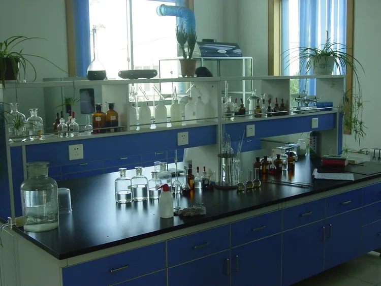 Technician preparing a sample for composition analysis